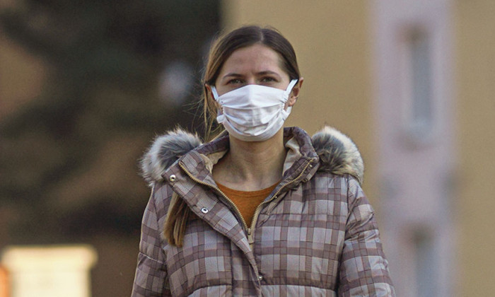 Image of New Zealand woman wearing a medical mask.